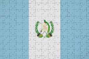 Guatemala flag  is depicted on a folded puzzle photo