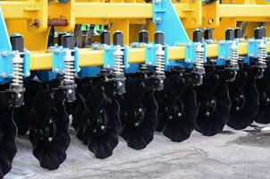 Spring system of agricultural seeder close up outdoors photo
