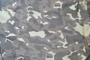 Camouflage background texture as backdrop for paintball and airsoft strikeball design projects photo