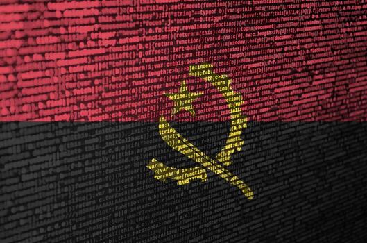 Angola flag  is depicted on the screen with the program code. The concept of modern technology and site development photo