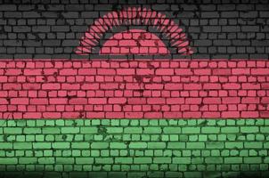 Malawi flag is painted onto an old brick wall photo