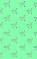 Shopping addiction, shopping lover or shopaholic concept. Many small empty shopping carts perform a pattern on a pastel colored paper background. Flat lay composition, top view photo