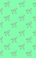 Shopping addiction, shopping lover or shopaholic concept. Many small empty shopping carts perform a pattern on a pastel colored paper background. Flat lay composition, top view photo