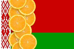 Belarus flag and citrus fruit slices vertical row photo