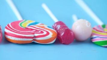 Close up Lollipops on a blue surface video