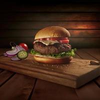 Delicious homemade steakburger on an old wooden table. Fat unhealthy food close-up. photo