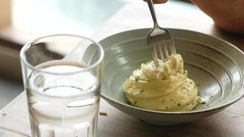 Bowl of mashed potatoes eaten with fork video