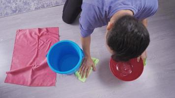 The Ceiling Of The House Is Leaking.  Man Holding Bucket As Water Drops Seek From The Ceiling. video