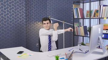 Exercising in the office. Businessman sitting on chair trying to stay healthy by exercising. video