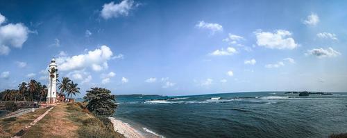 Lighthouse near sea. photo