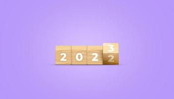 Flipping of 2022 to 2023 on wooden block cube for preparation new year change and start new business target strategy banner concept. 3D illustration. photo