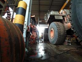 East Kutai, East Kalimantan, Indonesia, 2022 - Mining Dump Truck Maintenance at technical services box. photo