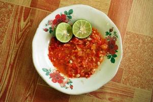 Sambal terasi jeruk nipis or Lime shrimp paste sauce tastes is good, suitable for grilled fish and vegetables. photo
