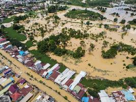 east kutai, east Kalimantan, Indonesia, 2022 - Aerial view of Situation Flood in . Floods hit homes and highways, disrupting transportation, floods because high rainfall. photo