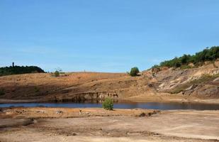 The Impact of coal mining on the environment. The mining location was abandoned without reclamation. Location at Sangatta, East Kalimantan, Indonesia. photo