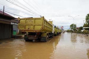 East Kutai, East Kalimantan, Indonesia, 2022 - Floods hit homes and highways because high rainfall and high tide of sea water. Location at sangatta, east kutai, Indonesia. photo