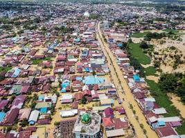 east kutai, east Kalimantan, Indonesia, 2022 - Aerial view of Situation Flood in . Floods hit homes and highways, disrupting transportation, floods because high rainfall. photo