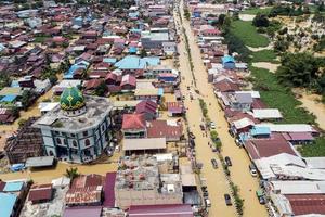 east kutai, east Kalimantan, Indonesia, 2022 - Aerial view of Situation Flood in . Floods hit homes and highways, disrupting transportation,  floods because high rainfall. photo