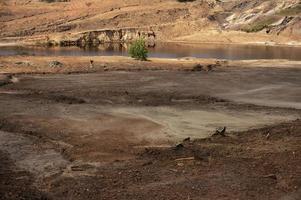 The Impact of coal mining on the environment. The mining location was abandoned without reclamation. Location at Sangatta, East Kalimantan, Indonesia. photo