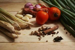 Indonesia herbs and spices on wooden table. Top view with selective focus. photo