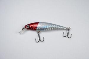 Plastic fishing lure on a white background, Lure minnow photo