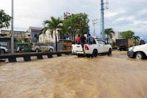 East Kutai, East Kalimantan, Indonesia, 2022 - Floods hit homes and highways because high rainfall and high tide of sea water. Location at sangatta, east kutai, Indonesia. photo