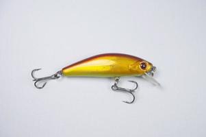 Plastic fishing lure on a white background, Lure minnow photo