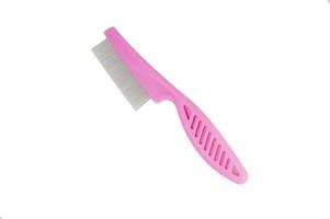 Comb anti flea for dog or cat on white background photo