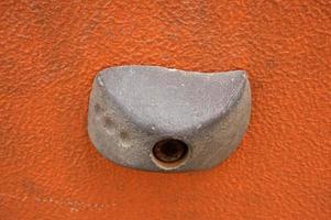 Stone hook on the artificial climbing wall at outdoor photo