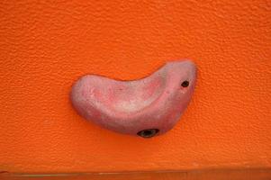 Stone hook on the artificial climbing wall at outdoor photo