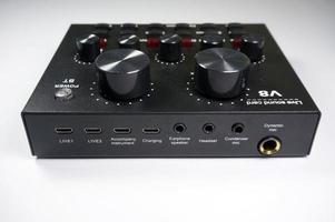 Sangatta, East Kutai, East Kalimantan, Indonesia,2020 - TAFF STUDIO audio soundcard  with faders and adjusting knobs,with selective focus. photo