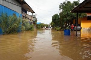 East Kutai, East Kalimantan, Indonesia, 2022 - Floods hit homes and highways because high rainfall and high tide of sea water. Location at sangatta, east kutai, Indonesia. photo