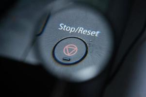 Stop or Reset button  under magnifying glass. photo