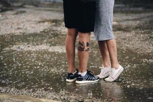 couple on the background of wet asphalt photo