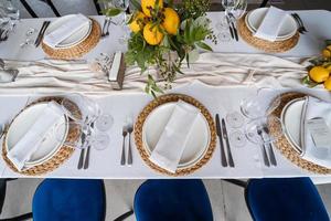 Festive table at the wedding party decorated with lemon arrangements photo