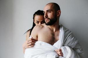 man and woman in the bedroom photo