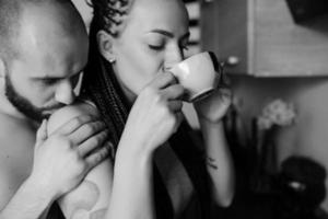 man and woman in the kitchen photo