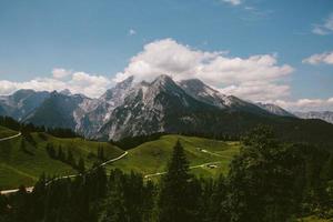 a path among mountains in the summer photo