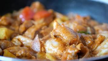 Close up of simmering meat and vegetables cooking in sauce pan video