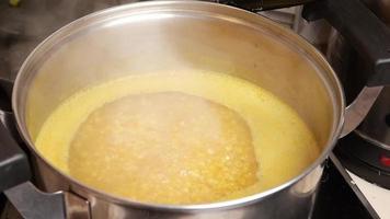 Large stock pot of corn boiling video