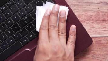 Sanitizing a keyboard with a  tissue video