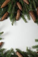 Holidays greeting card or banner composition with pine tree branches. Merry Christmas background and Happy New Year 2023. photo