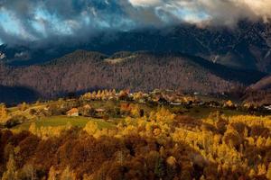 A charming mountain landscape in Carpathians, Romania. Autumn nature in Brasov, Europe photo