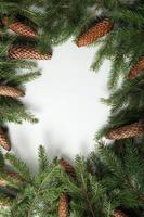 Holidays greeting card or banner composition with pine tree branches. Merry Christmas background and Happy New Year 2023. photo