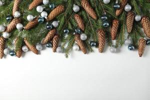 Holidays greeting card or banner composition with pine tree branches. Merry Christmas background and Happy New Year 2023. photo