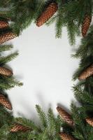 Holidays greeting card or banner composition with pine tree branches. Merry Christmas background and Happy New Year 2023. photo