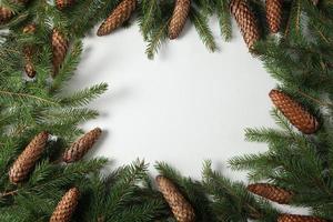 Holidays greeting card or banner composition with pine tree branches. Merry Christmas background and Happy New Year 2023. photo