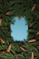 Holidays greeting card or banner composition with pine tree branches. Merry Christmas background and Happy New Year 2023. photo