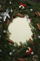 Holidays greeting card or banner composition with pine tree branches. Merry Christmas background and Happy New Year 2023. photo