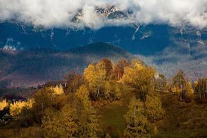 A charming mountain landscape in Carpathians, Romania. Autumn nature in Brasov, Europe photo